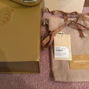 Sabyasachi Gold Clutch with Signature Design